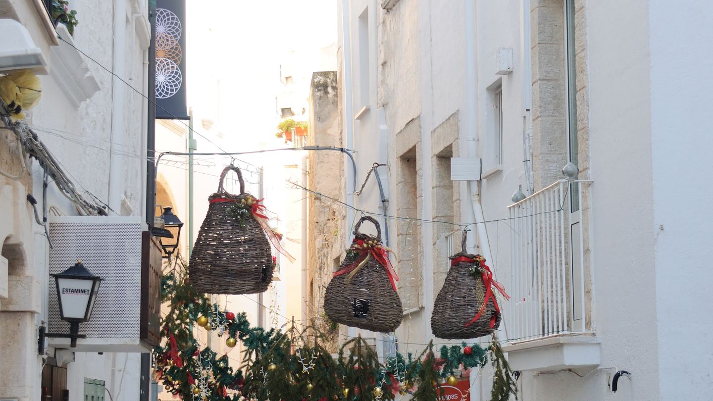 Christmas lights over a street in Polignano a Mare