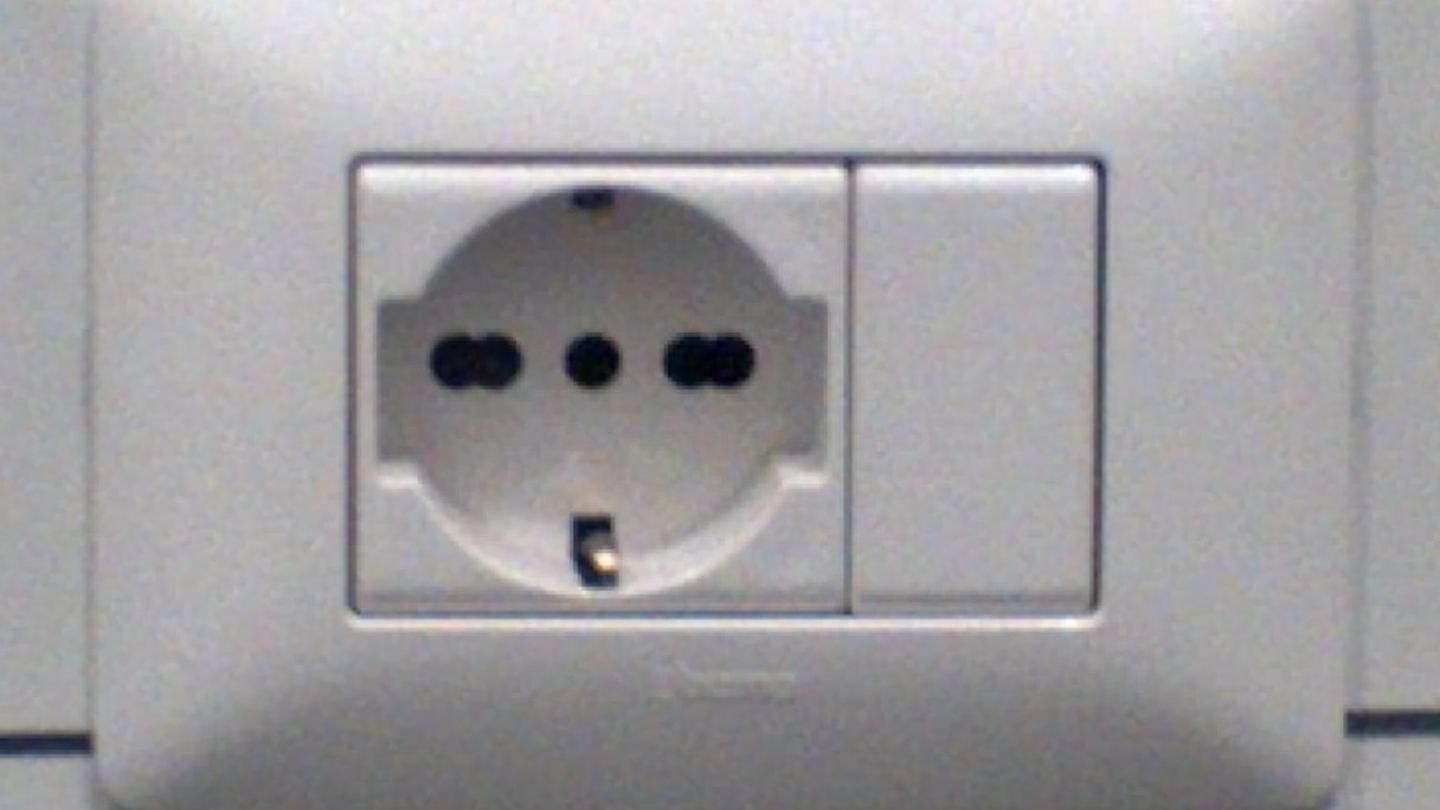 A modern Italian multi-standard wall socket with two- and three-pin openings