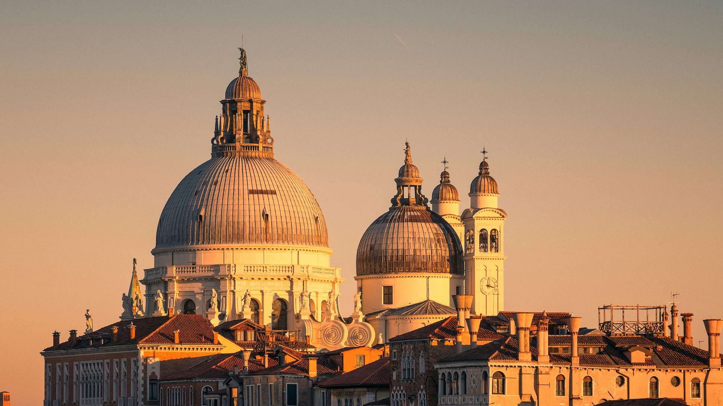 Golden evening light on the domes and palaces of Santa Maria della Salute in Venice
