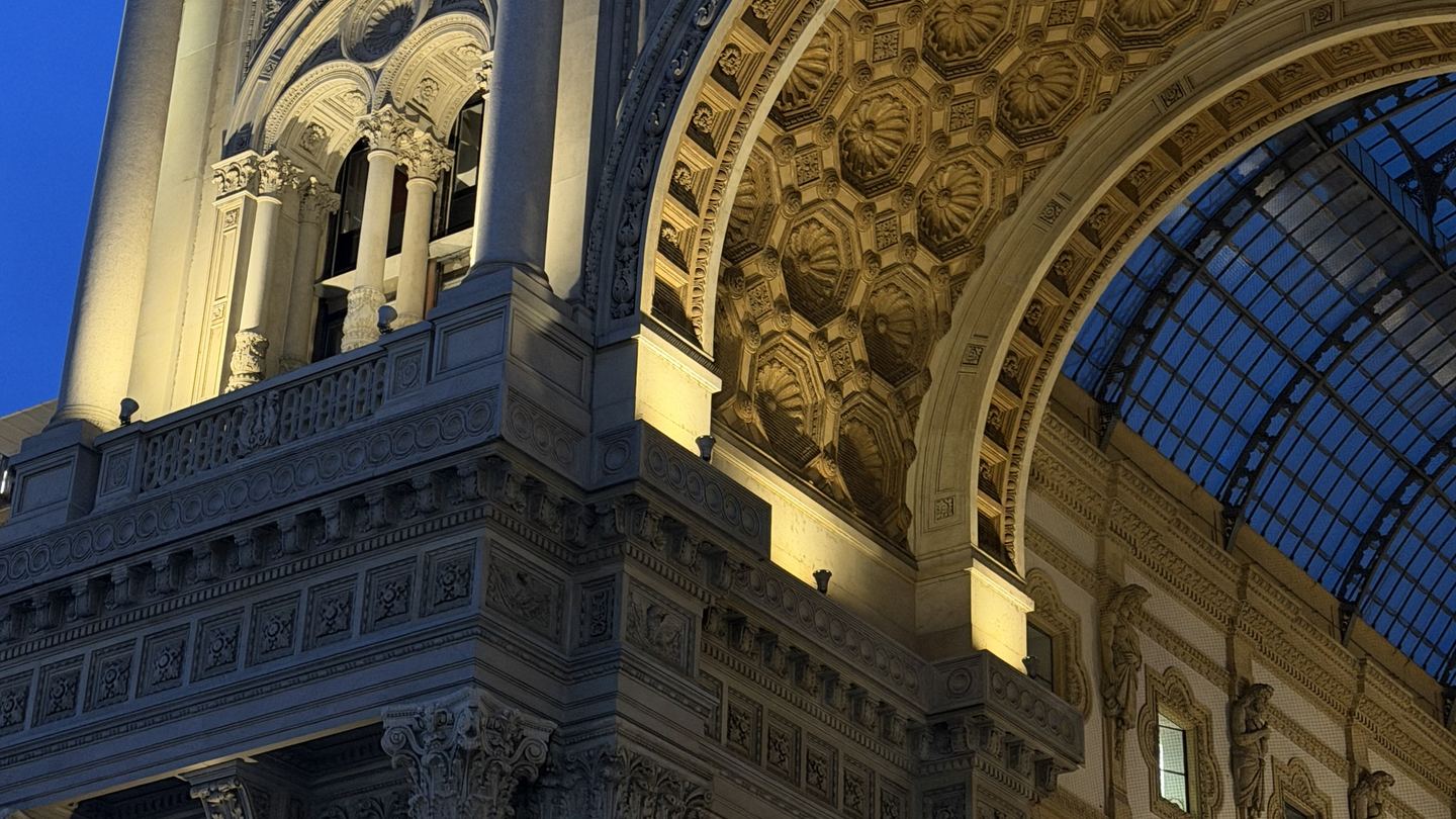 The illuminated Galleria Vittorio Emanuele II in Milan at evening