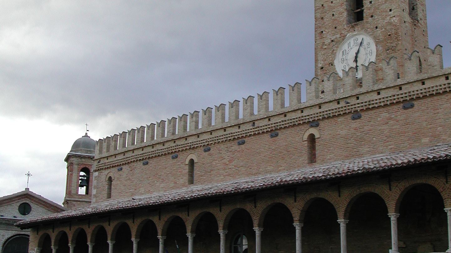 The brick loggia and clock tower of Offida town hall