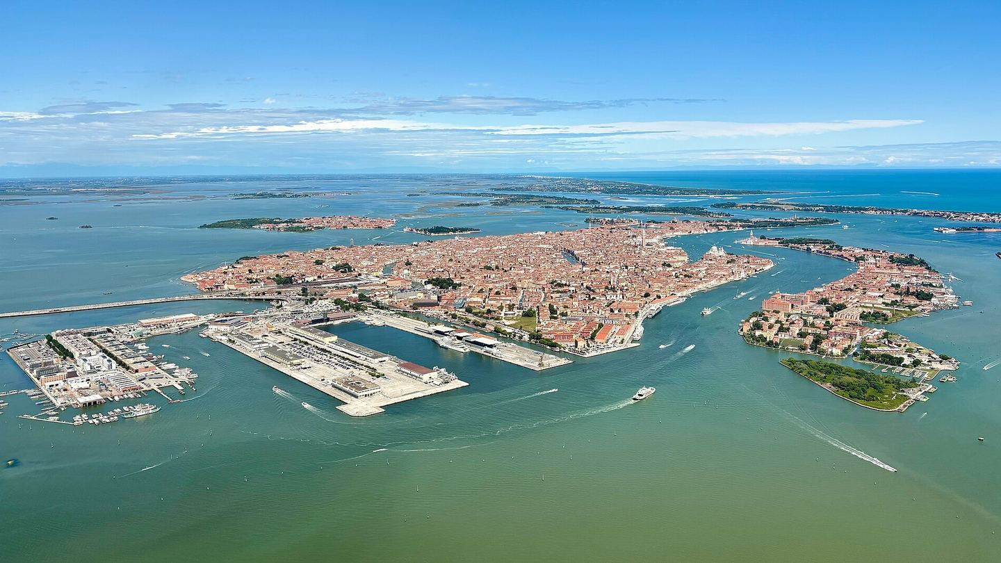 Aerial view across Venice, its canals and the lagoon