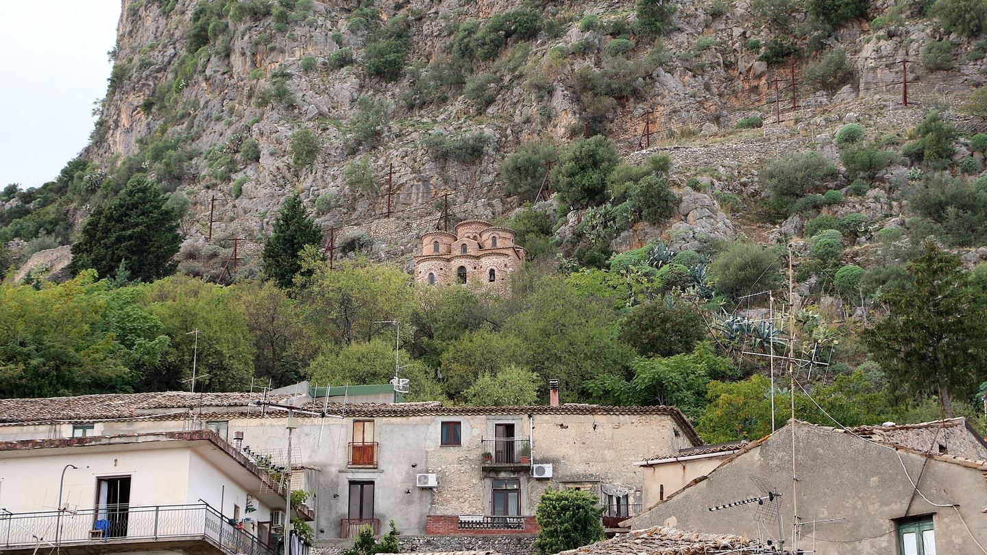 The compact Byzantine church of Cattolica di Stilo on a rocky hillside